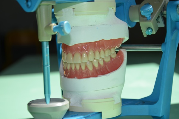 How Denture Adjustments Can Help With Sore Spots